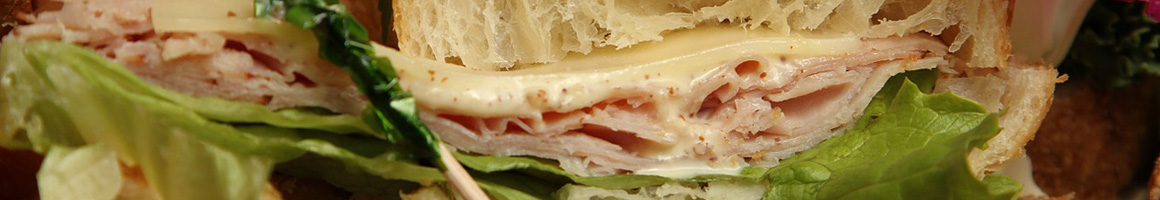 Eating Deli Sandwich at Columbia Deli restaurant in Philadelphia, PA.